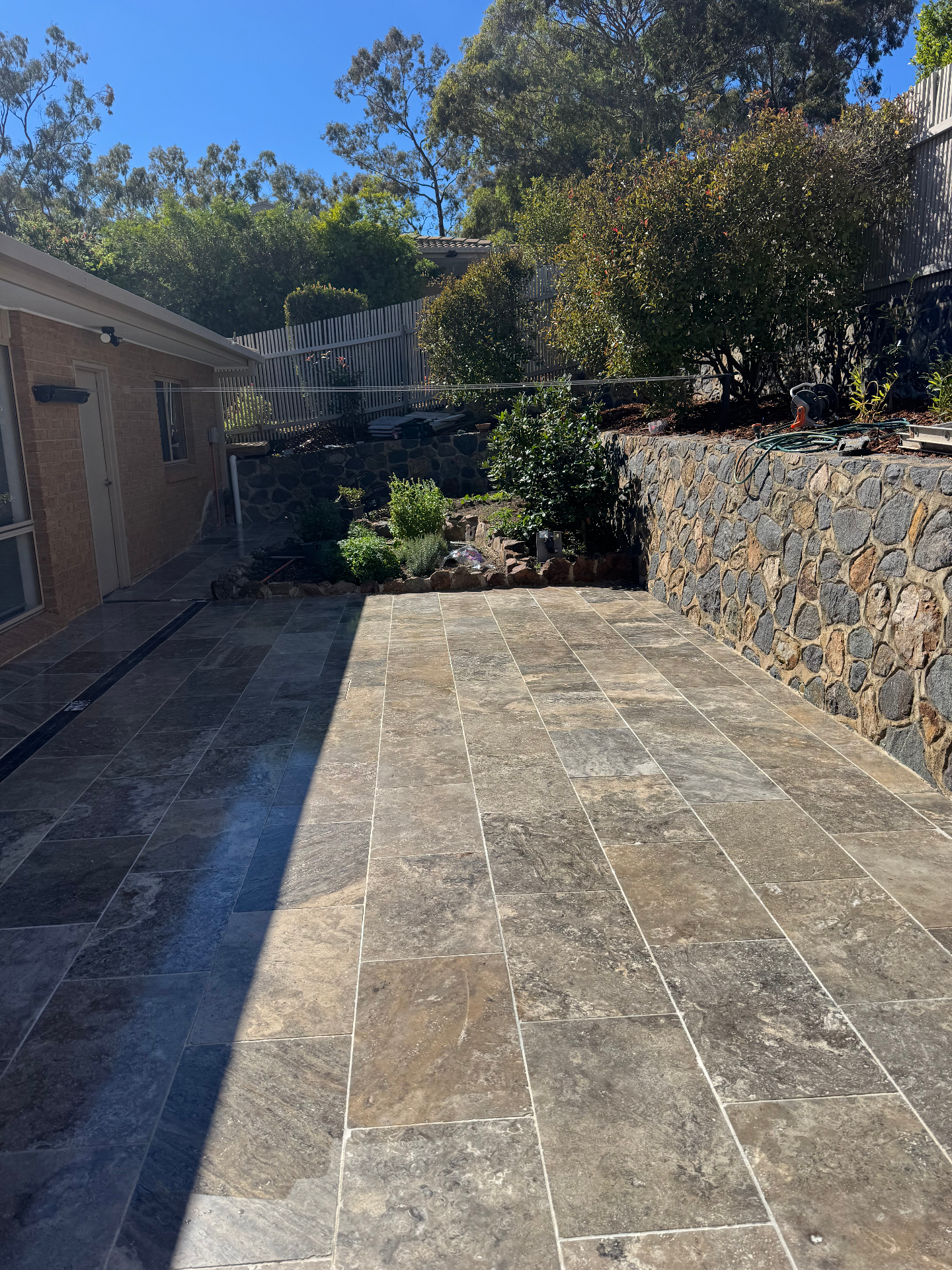 Concrete sleeper retaining wall and lawn